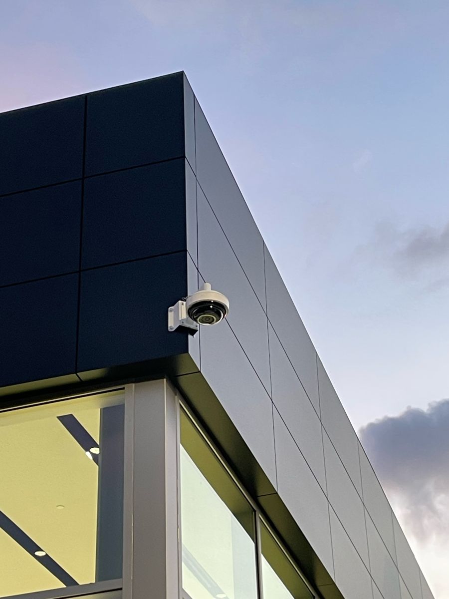 Dome security camera mounted on a building corner