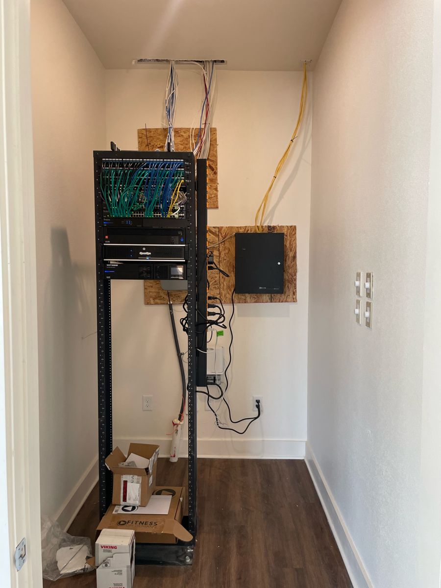Network rack in a closet installed by NeuraTech Security