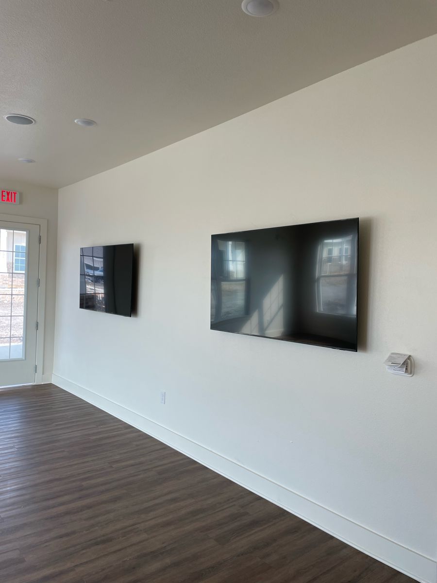 Wall-mounted TVs installed by NeuraTech Security