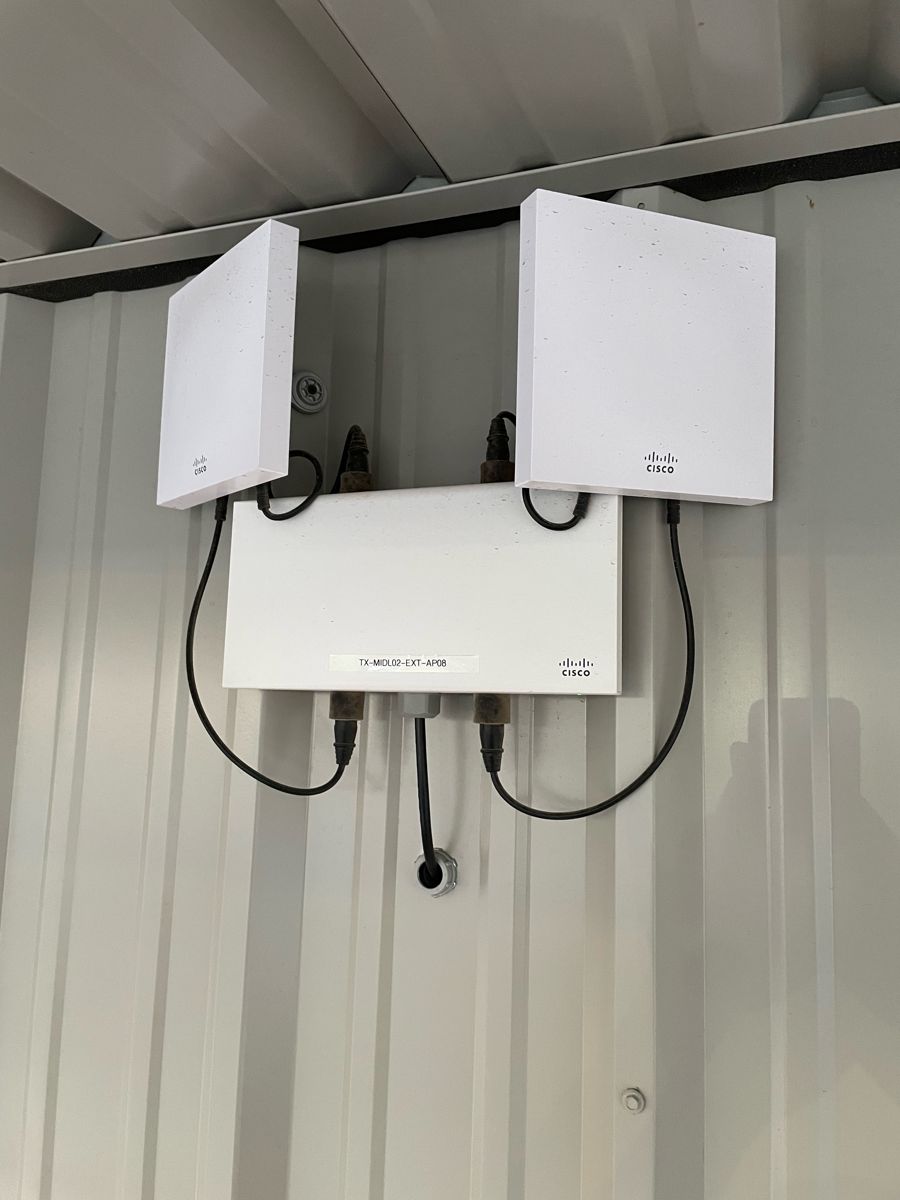 Exterior wireless access points installed on a building